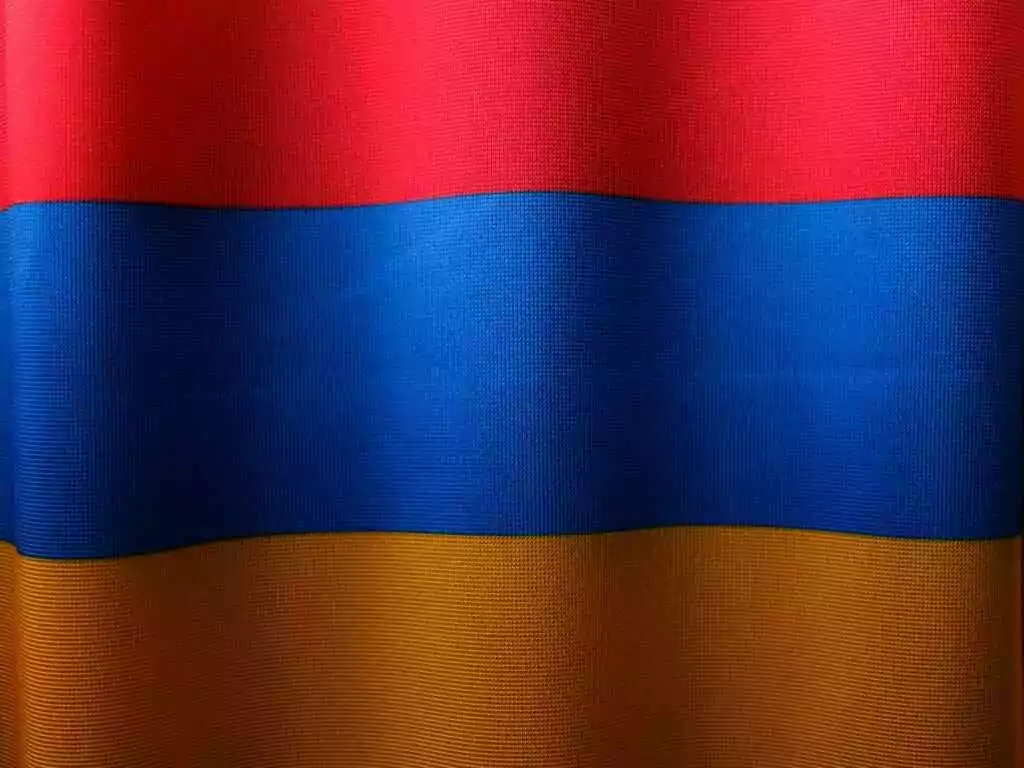 Armenia Visa for UAE: How to get it? 10 Close-up of the colorful Armenian flag with red, blue, and orange stripes symbolizing national pride.