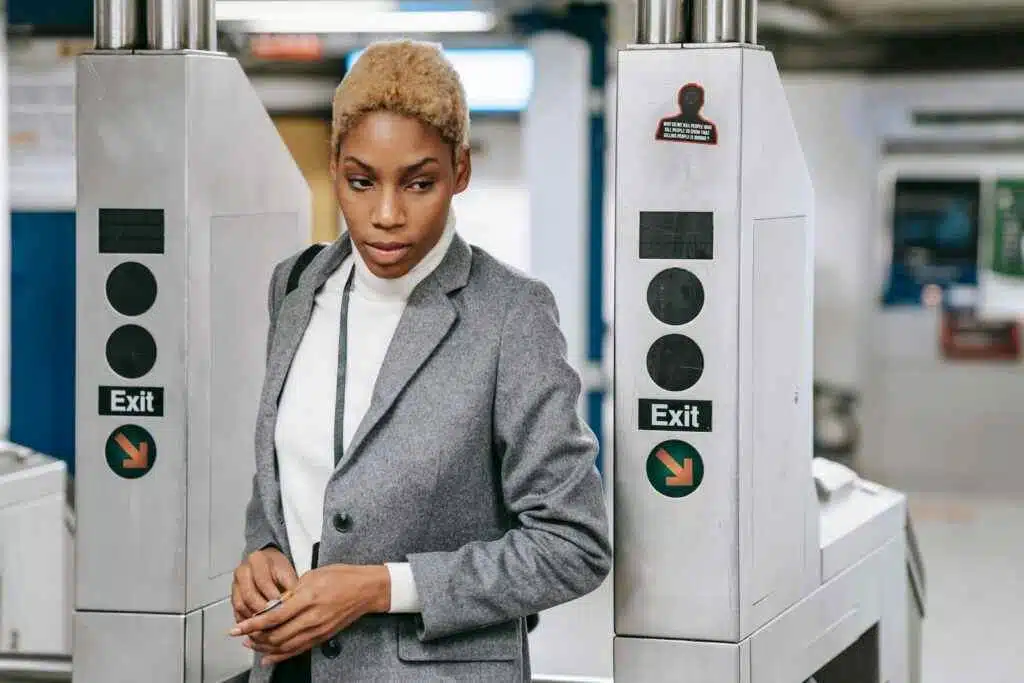 Speed Up Your Travel: Sharjah Airport's Smart Gate Guide 8 Elegant woman in stylish business attire exiting a modern subway station.