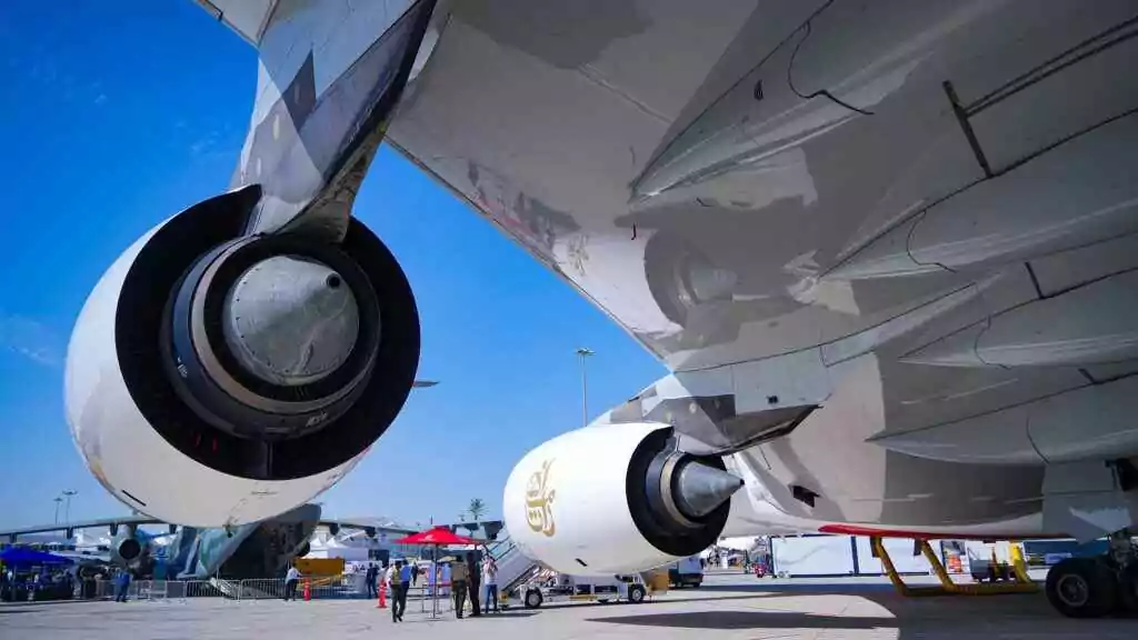 Dubai Creek FAST: Metro Hack in Minutes (Skip Taxis!) 4 Detailed view of Emirates A380 jet engines parked at Dubai airport.
