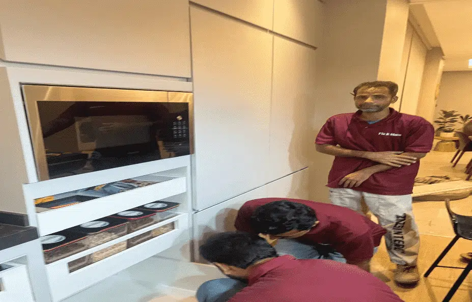 Transform Fixitmates Premier Home Maintenance and Joinery Services in Dubai 9 Three men doing electrical services inside home