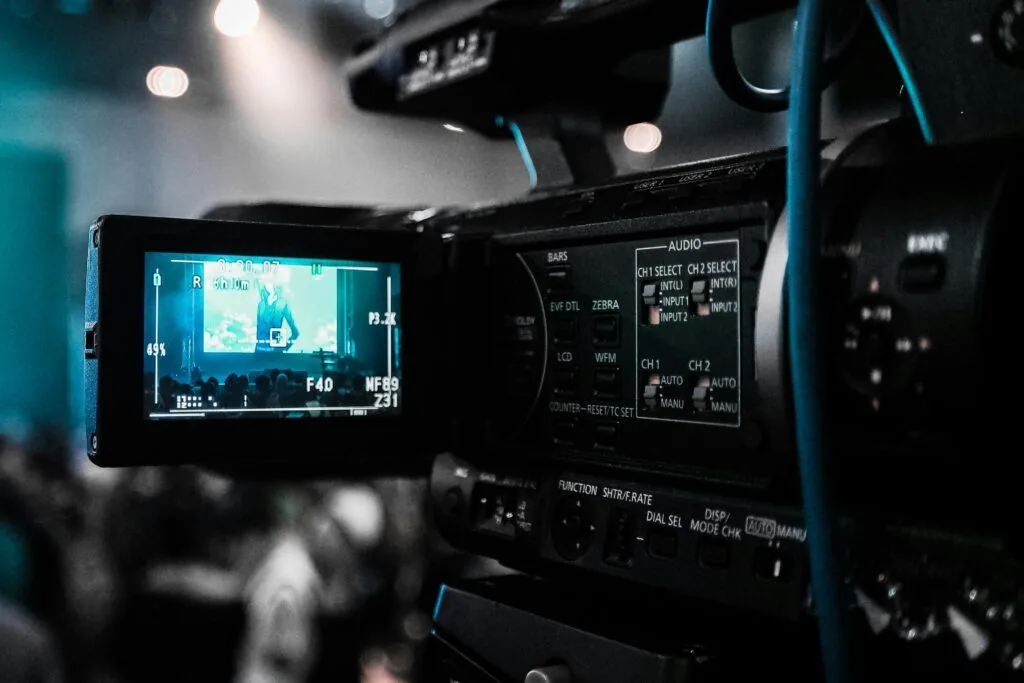 5 Smart Ways to Use AI Explainer Videos for Product Launches 2 HD video camera capturing a live event; focus on screen and controls.