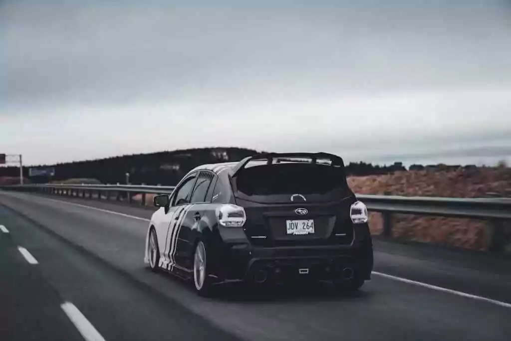 A black color small car on road