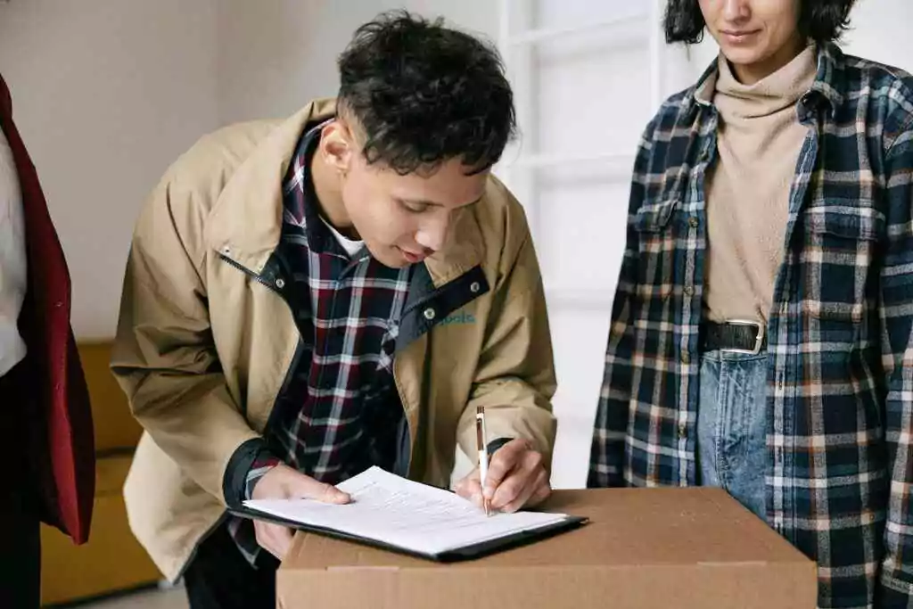 A man signing a paper