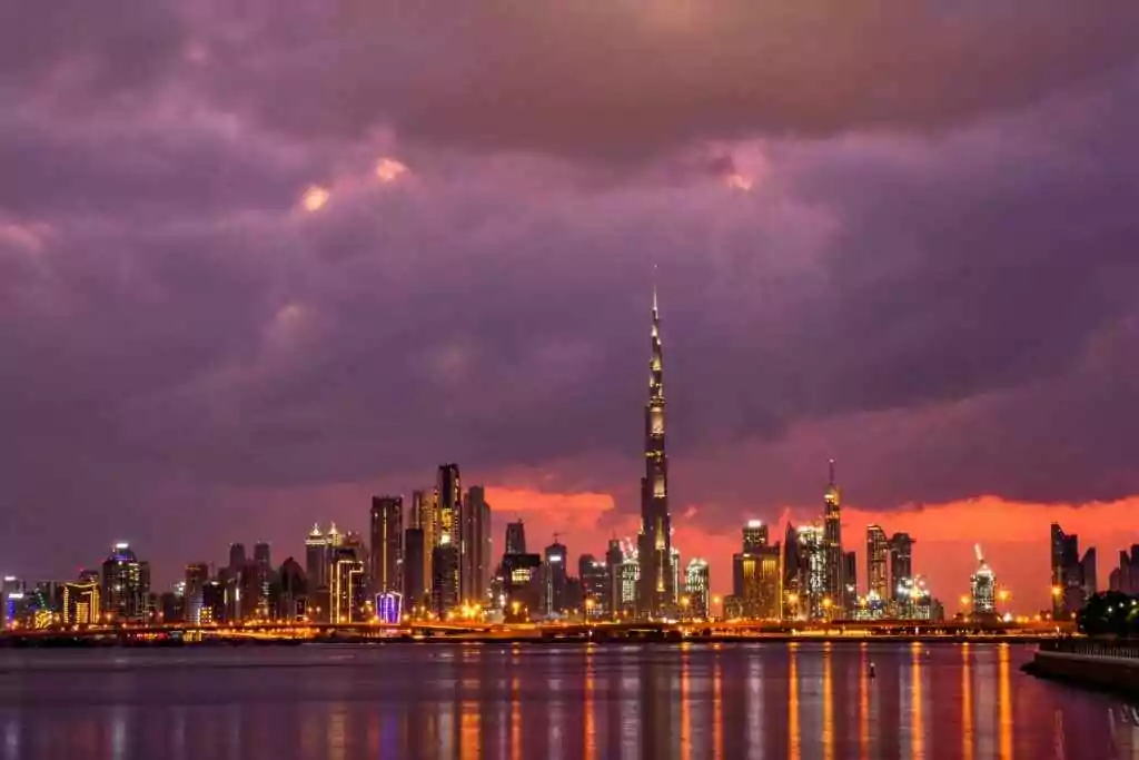 Stunning sunset view of Dubai skyline featuring the iconic Burj Khalifa.