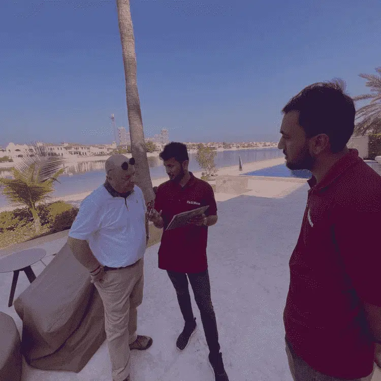 three men talking to each other
