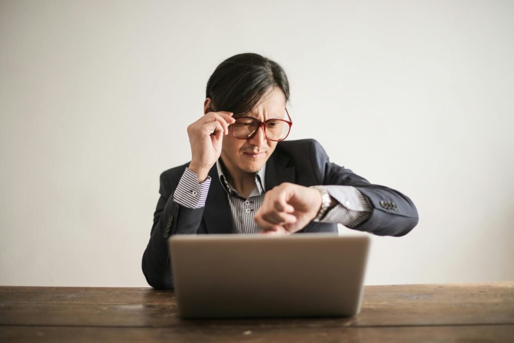 A man looking at his watch