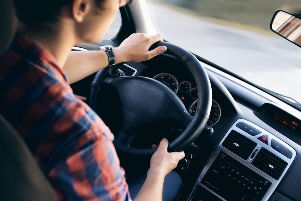 A man driving his vehicle