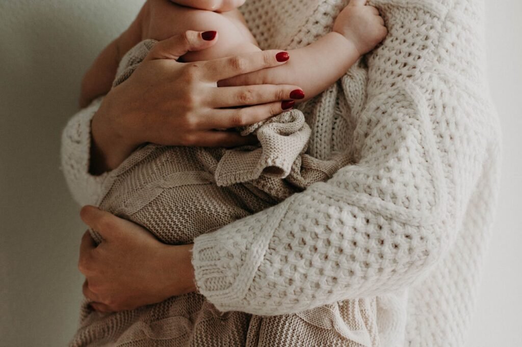 Photo of a woman holding a baby