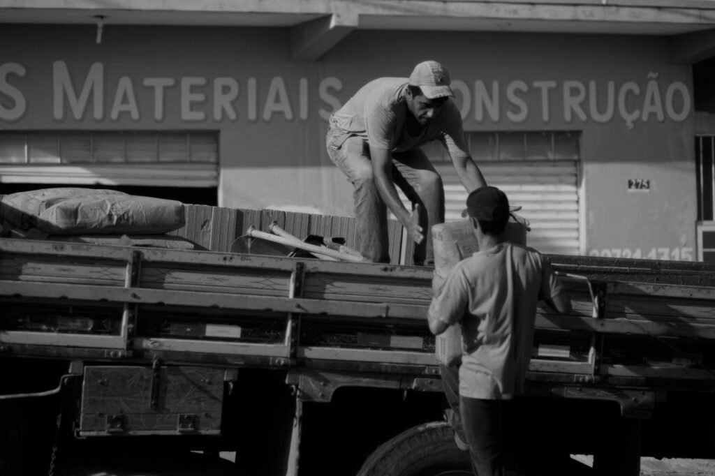 Photo of two men working