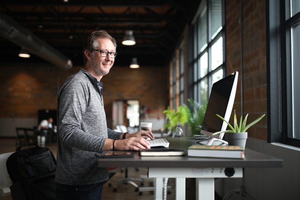 A man sitting in front of a computer.