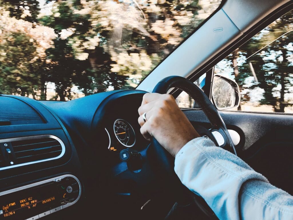 Photo of a man driving his car