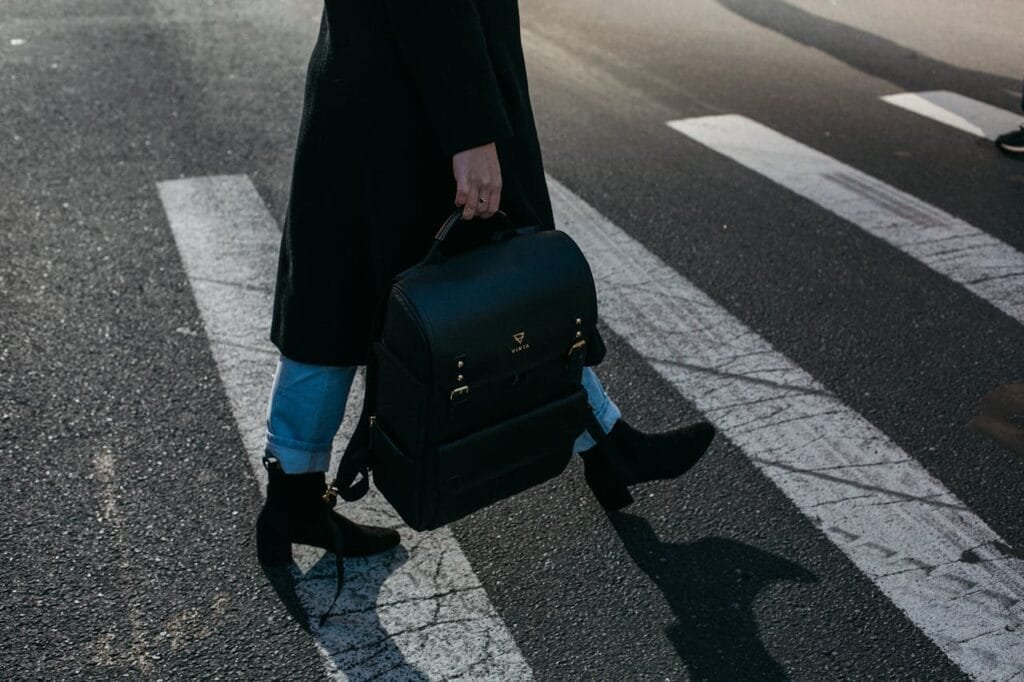 A person crossing pedestrian crossing