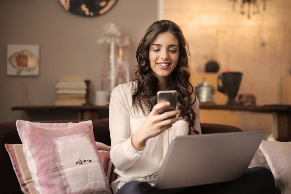 Woman sitting on a sofa using mobile