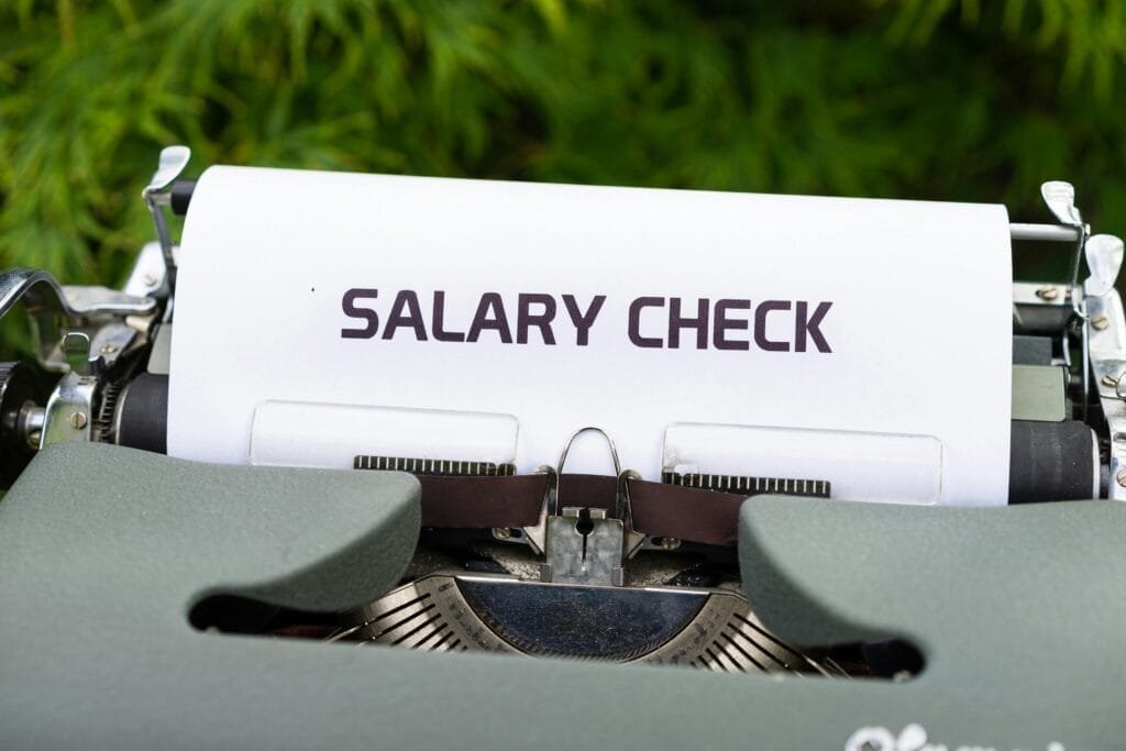 A printer printing a paper with salary check written on it