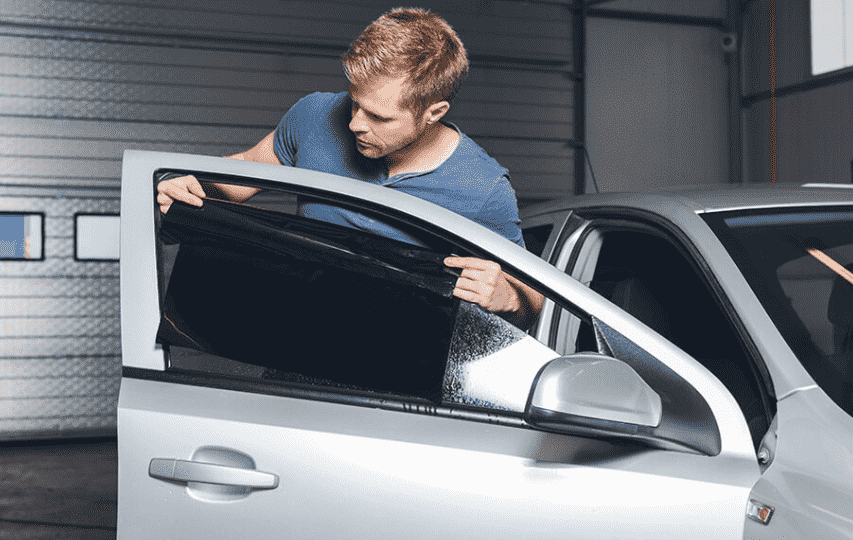 Car Window Tinting Specifications in Dubai 4 A man checking car window tinting