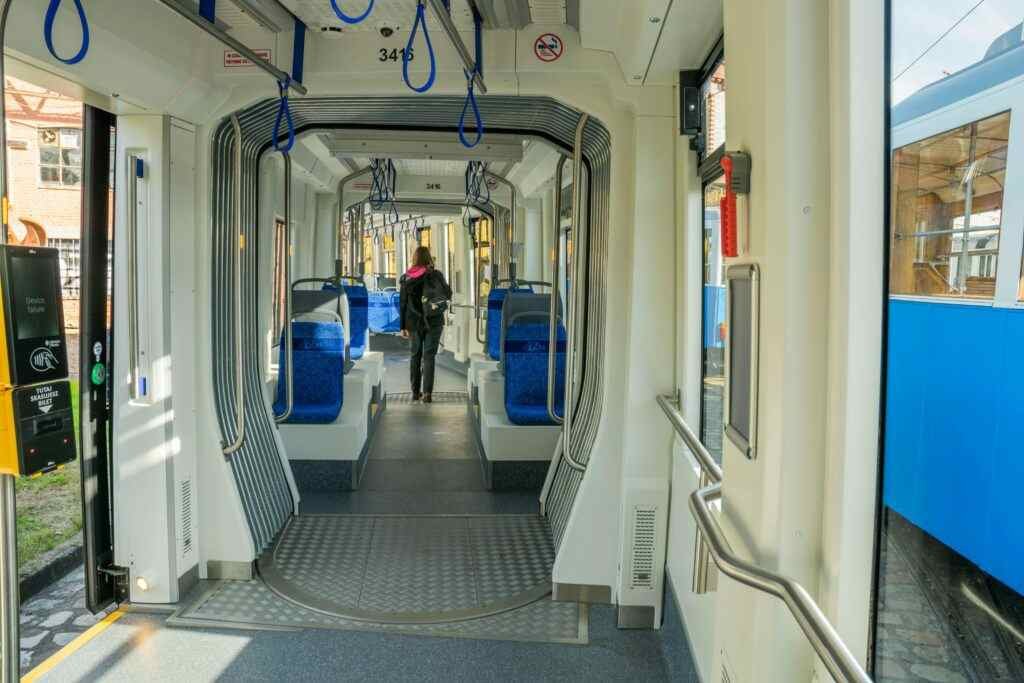Explore the spacious interior of a modern tram in Wrocław, showcasing urban transit solutions.