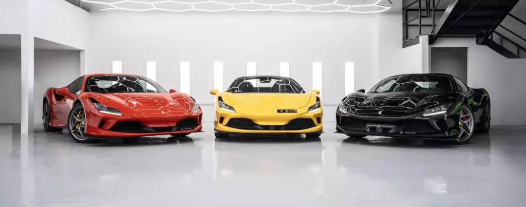 Luxury Car Rental in Dubai for the Weekend – Elevate Your Experience 6 A black, Yellow and a red car