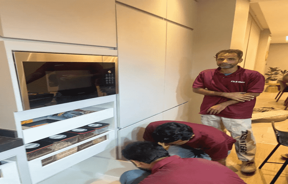 Three men doing electrical services inside home