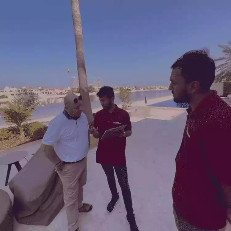 three men talking to each other