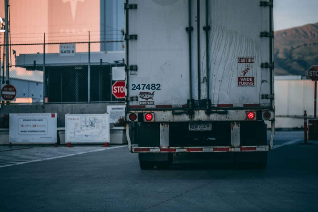Semi truck parked at a loading=