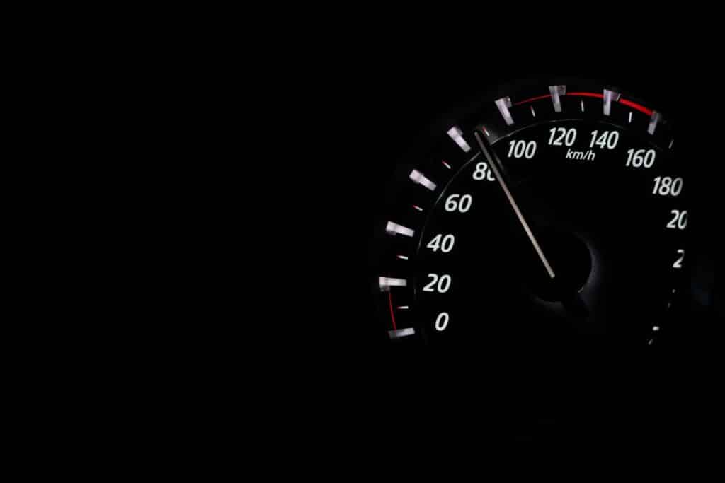 Check EVG Fine Online in UAE 2 Speedometer reading showing speed in km/h on a dark background.